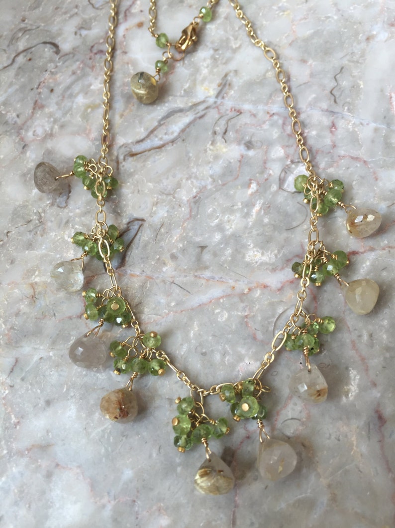 Rutilated quartz dangle necklace with peridot clusters