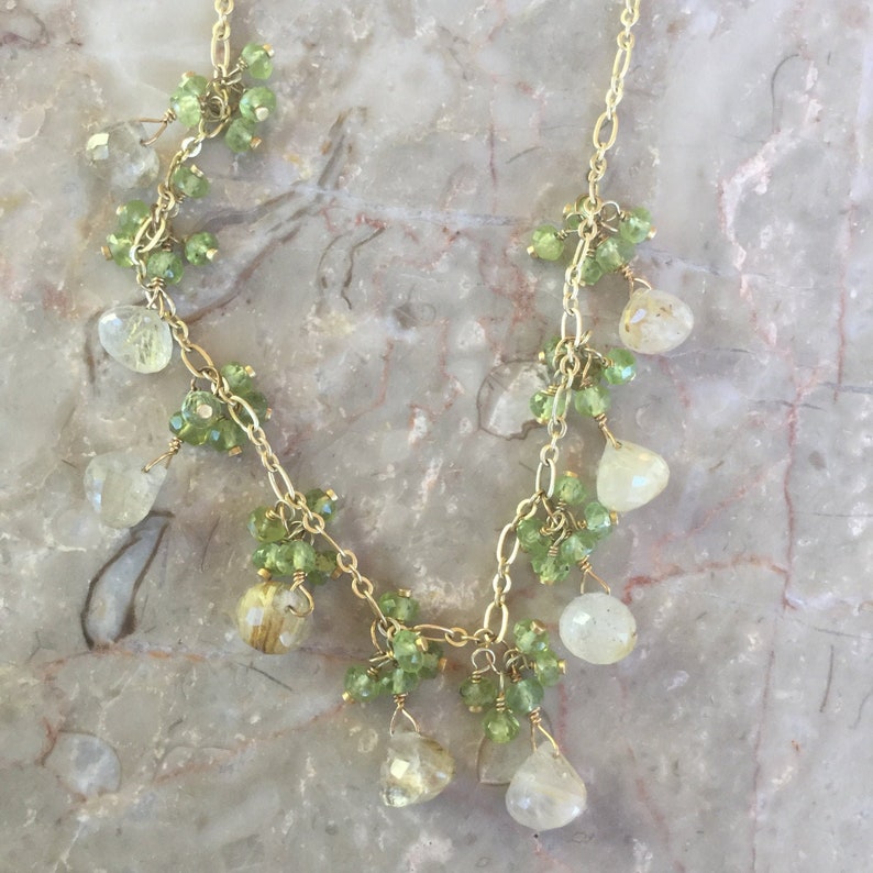 Rutilated quartz dangle necklace with peridot clusters