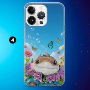 May include: A clear phone case featuring a cartoon illustration of a smiling, brown creature surrounded by purple and pink flowers, butterflies, and bubbles against a blue sky background. The number "4" is in a black circle in the upper left corner.