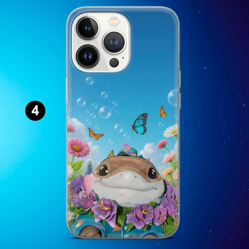 May include: A clear phone case featuring a cartoon illustration of a smiling, brown creature surrounded by purple and pink flowers, butterflies, and bubbles against a blue sky background. The number "4" is in a black circle in the upper left corner.