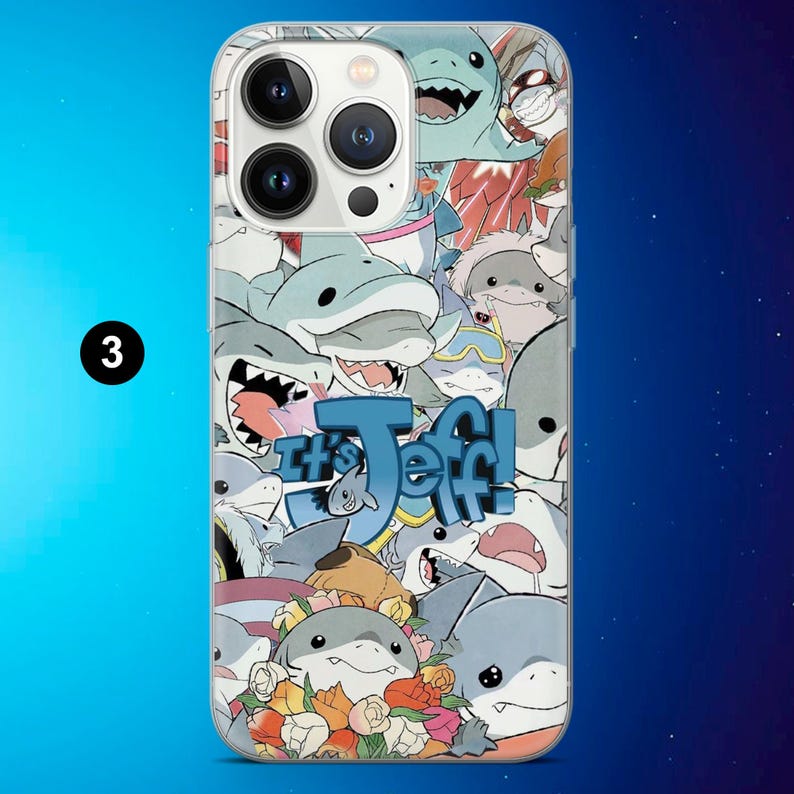 May include: A clear phone case featuring a collage of cartoon sharks in various poses and colors. The phrase "It's Jeff!" is displayed in blue, stylized text. The case has a glossy finish and is designed for a smartphone.