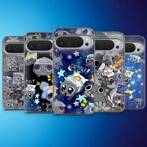 May include: A collection of five phone cases featuring a cartoon character named Pebble. Each case has a different design, including stars, rocks, and other cartoon elements. The cases are in shades of gray, blue, and white.