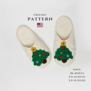 May include: Two cream-coloured crochet slippers featuring a green Christmas tree design. The slippers have a textured finish and are decorated with red, yellow, and blue accents. The image includes the text "CROCHET PATTERN" and size information in EU, US, and UK sizes.