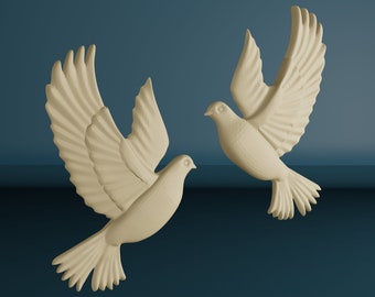 May include: Two white ceramic doves in flight, with wings spread wide, against a dark blue background.