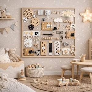 May include: A wooden sensory board with various interactive elements, including gears, switches, latches, and a clock. The board is mounted on a wall in a child's room, with the name "PAUL" displayed. Other toys and furniture are also visible.