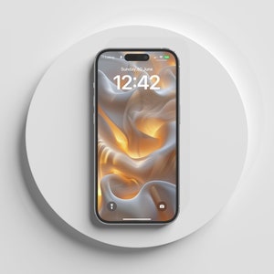 May include: A silver smartphone with a white background and a screen displaying the time 12:42 and the date Sunday, 30 June.
