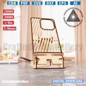 Puede incluir: Un soporte para tel&eacute;fono de madera cortado con l&aacute;ser con un dise&ntilde;o a rayas. El soporte est&aacute; dise&ntilde;ado para sostener un tel&eacute;fono inteligente en modo vertical u horizontal. El soporte est&aacute; hecho de madera de 3,18 mm de grosor y est&aacute; probado en una m&aacute;quina de l&aacute;ser de diodo.