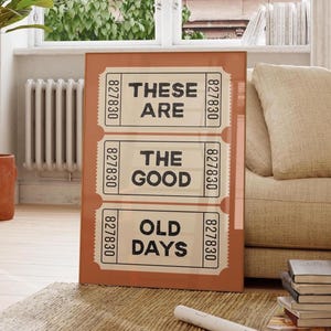 Pode incluir: Um cartaz castanho e bege com o texto "These are the good old days" impresso nele. O cartaz é projetado para parecer um conjunto de bilhetes antigos.