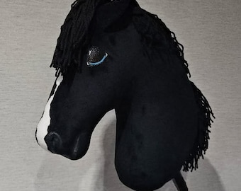 Hobby horse A3 A4 A5 black with a white spot blaze