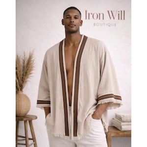 Puede incluir: Kimono de lino beige con ribete marrón y detalles de flecos. La parte superior se combina con pantalones blancos. La imagen incluye el texto "Iron Will Boutique".