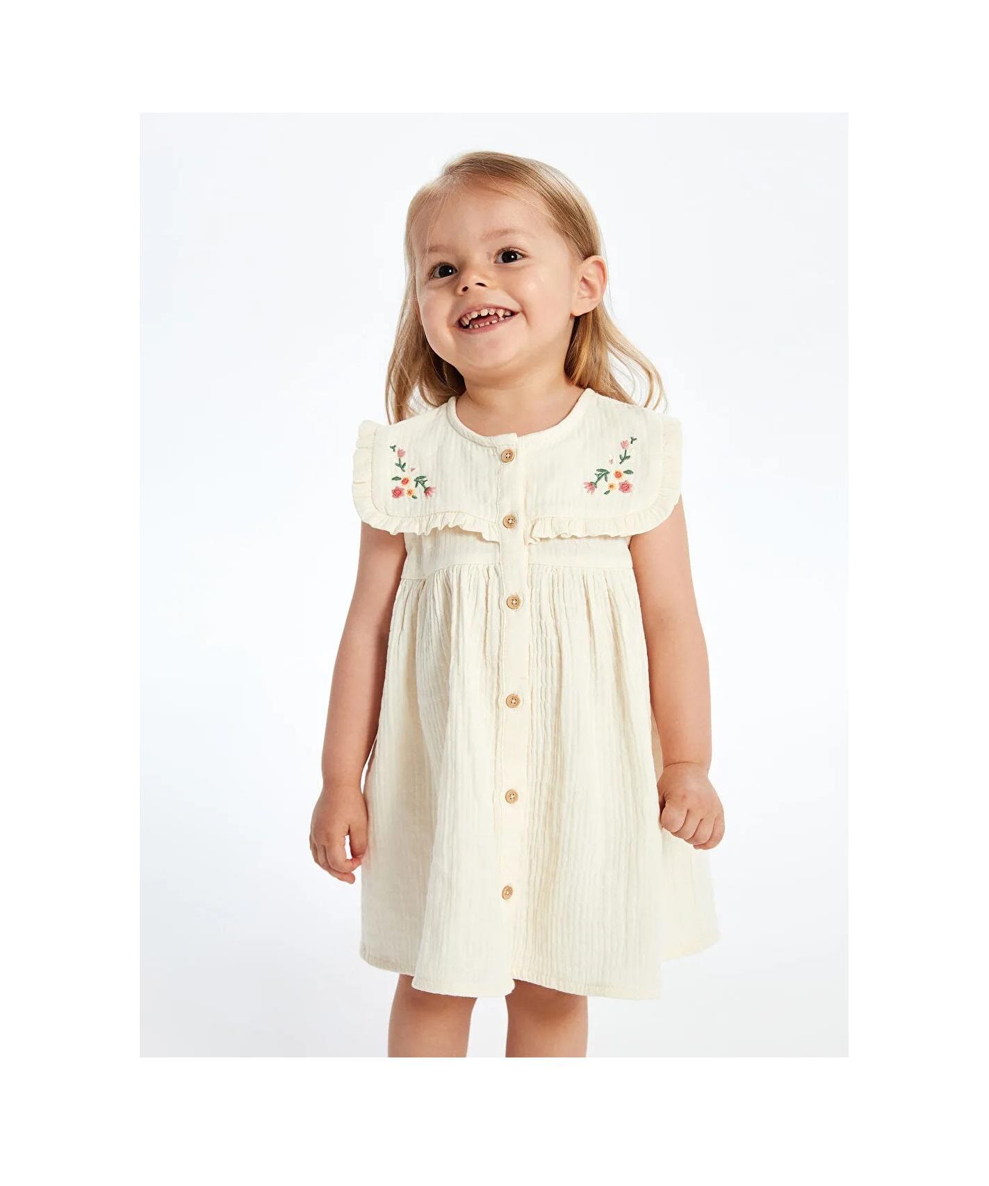 20 Baby Dress Designs for Summer That Are Actually Soft Enough to Wear 8 Floral Embroidered Muslin Baby Dress: Soft Cotton Sleeveless Summer…