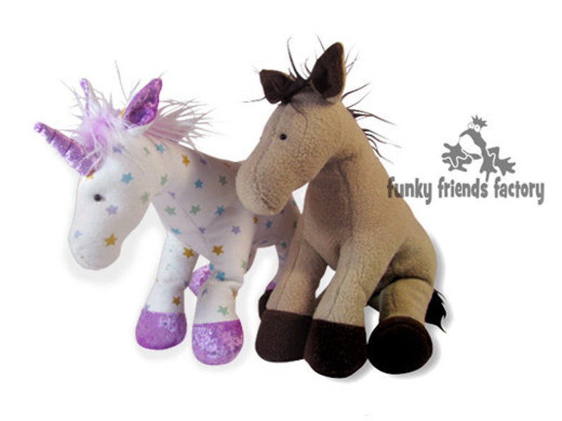 May include: Two plush toys, a white unicorn with purple and pink accents and a brown horse. The unicorn has a white body with colorful stars and a purple horn. The horse has a brown body with a black mane and tail.