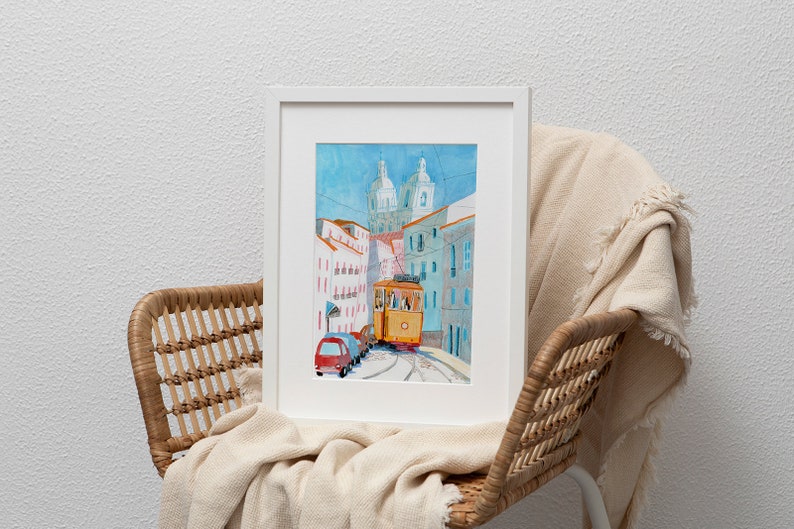 May include: A watercolor painting of a yellow tram traveling up a hill in a city. The tram is surrounded by colorful buildings and a blue sky.