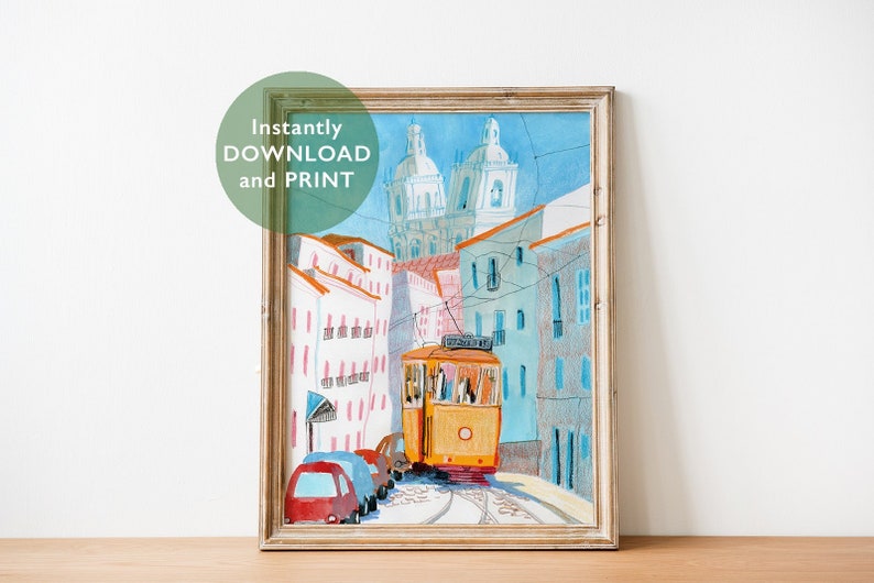 May include: A watercolor painting of a yellow tram traveling up a hill in Lisbon, Portugal. The tram is surrounded by colorful buildings and a church in the background.