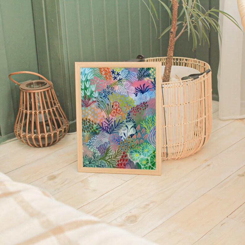 May include: A framed print of a colorful abstract painting featuring a variety of shapes and colors, including pink, blue, green, and yellow. The painting is reminiscent of a garden or a coral reef.