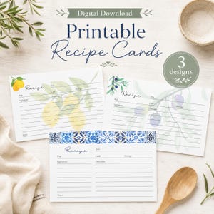 May include: Three printable recipe cards featuring watercolor illustrations of lemons, olives, and blue and white Mediterranean tiles. Each card includes printed lines for title, prep, cook, servings, ingredients, directions, and notes. Text reads Digital Download, Printable Recipe Cards, and 3 designs.