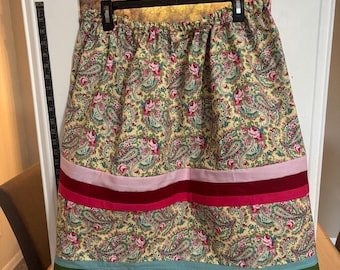 Paisley floral design with bands of solid colors to really accent the design