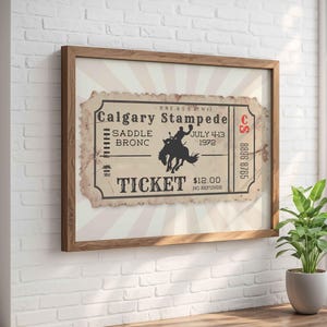 Looking for a unique cowboy themed gift? This rodeo ticket wall print combines history, design, and masculine charm. Ideal for bars, home offices, and western collectors. Available in multiple sizes for any wall.
Vintage Rodeo Poster, Retro Calgary Stampede Ticket, Western Cowboy Print, Rodeo Bronc Rider, Bar Cart Decor, Americana Wall Art for Him