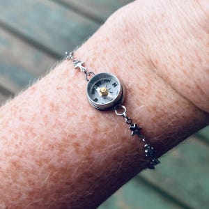 small working compass on an adjustable silver bracelet chain