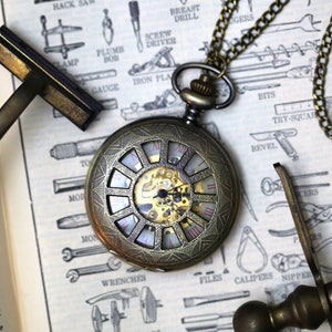 Cogwheel Mechanical Pocket Watch on Pocket Chain or Necklace available in bronze or silver.