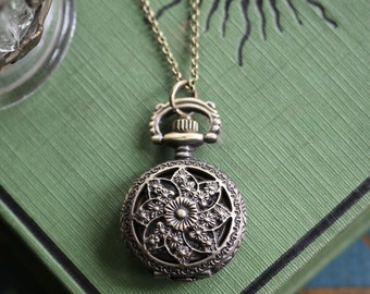 Pinwheel or Stars Battery Operated Pocket Watch Necklace in Antiqued Brass