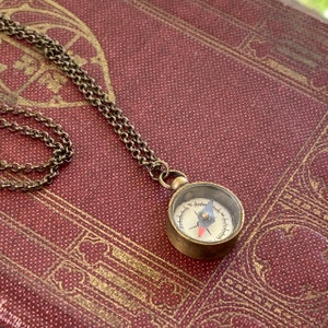 Antiqued brass working compass necklace. Makes a great gift for moving or graduation.