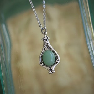 Antiqued silver vintage style drop pendant necklace with semi-precious aventurine stone cabochon set on silver plated art nouveau setting.