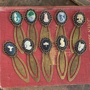 Antiqued brass cameo bookmarks in vintage style by ragtrader.  Choose from mermaid flamingo rabbit bunny skeleton humming bird lady dragonfly cat or angel.