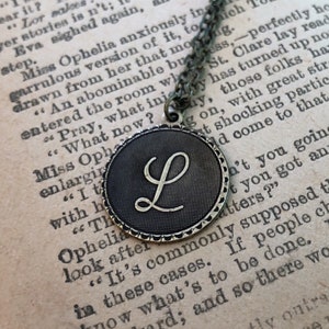 Letter monogram necklaces in antiqued silver or brass in vintage style.