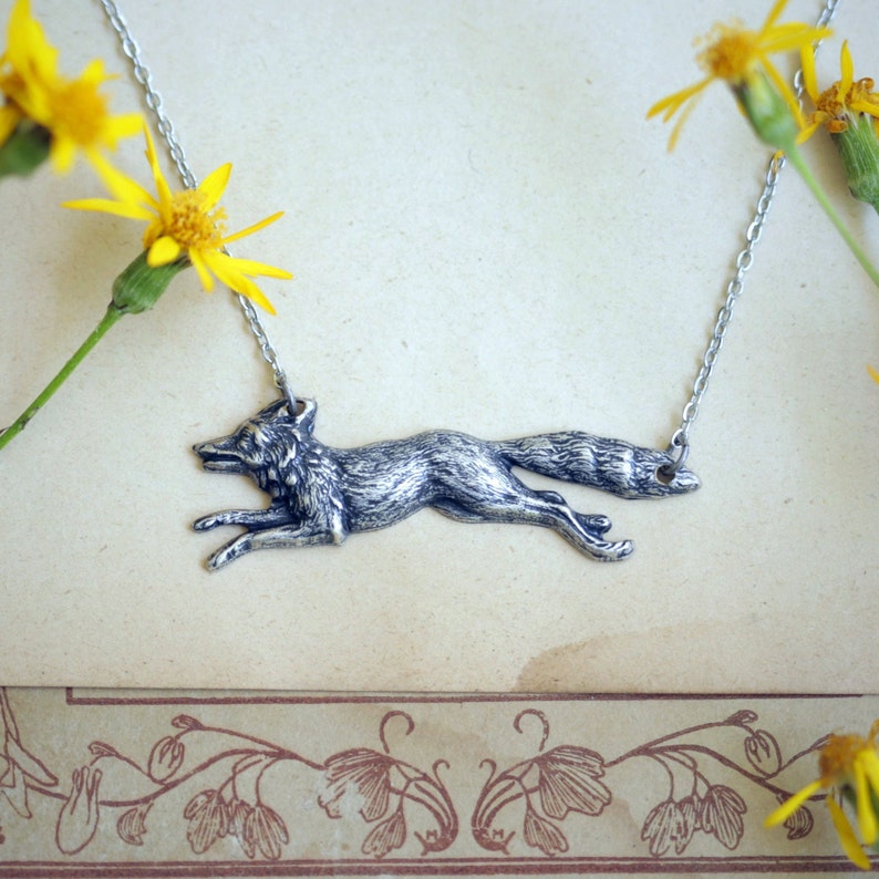 Antiqued silver running fox necklace pendant in vintage style.