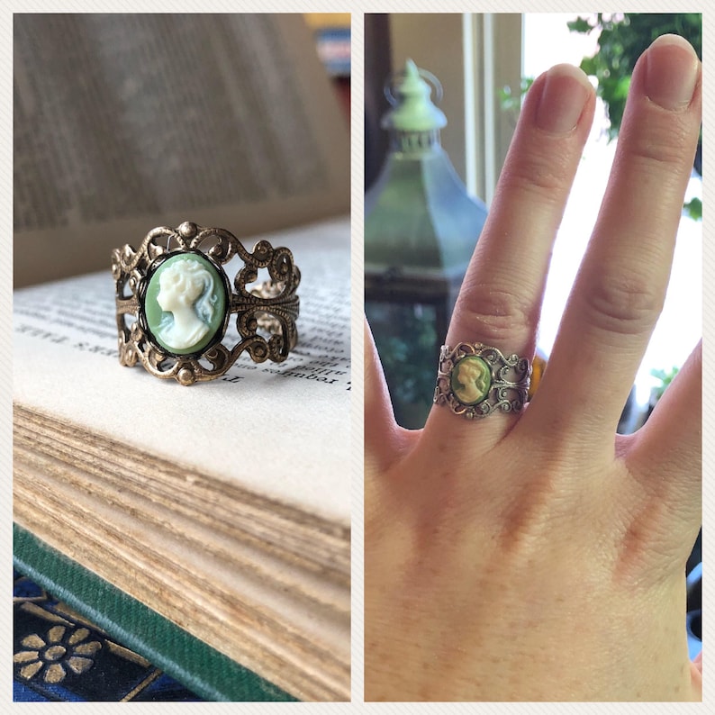 Antiqued brass and silver adjustable filigree ring in vintage-style with a green and cream small lady cameo set on a bezel.