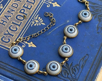 Eye Ball Bracelet in Antiqued Brass- choose green, brown or blue eyes.