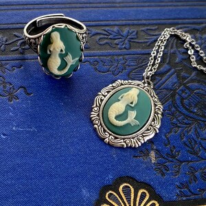 Antiqued silver adjustable vintage style ring with a blue and cream mermaid cameo with matching necklace.