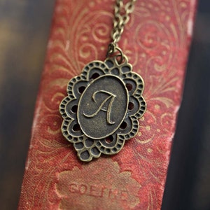 Letter A monogram antiqued brass necklace pendant in vintage style.