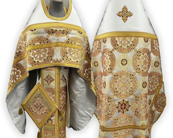 May include: White liturgical vestments with gold and red embroidery. The vestments feature a cross design and intricate patterns.