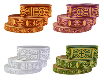 May include: Four spools of decorative trim with a cross and geometric pattern. The trim is available in red and gold, purple and gold, white and gray, and green and gold.
