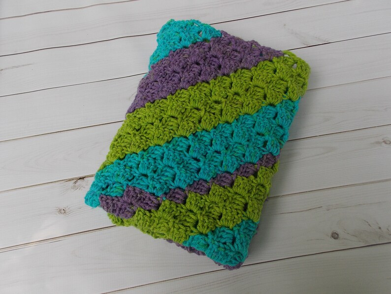 pram stroller car seat aqua crocheted diagonal stripe baby blanket afghan rug purple green multicolored stripes girl