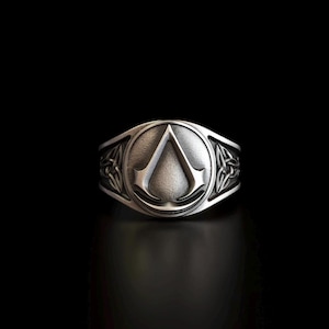 May include: A white ceramic mug with a black handle and the text "But First, Coffee" in a handwritten style. The mug is on a white surface. The mug is 4 inches tall.