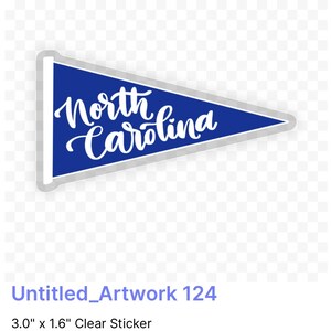 May include: A blue pennant-shaped sticker with white text that reads "North Carolina". The sticker is 7.6 cm by 4.1 cm.