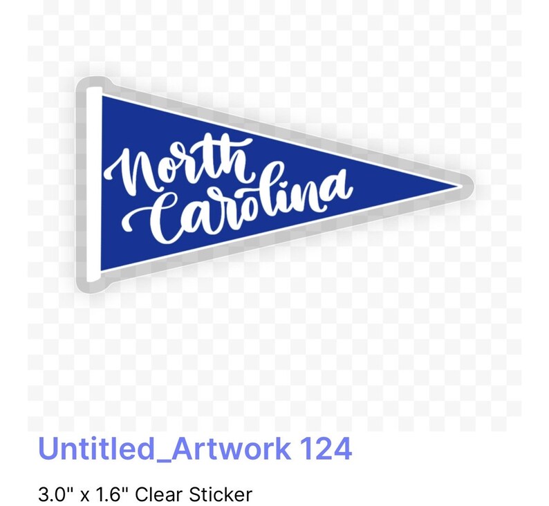 May include: A blue pennant-shaped sticker with white text that reads "North Carolina". The sticker is 7.6 cm by 4.1 cm.