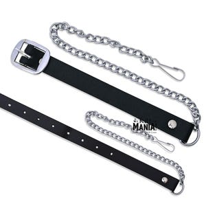 May include: Two black leather belts with silver buckles and chains. One belt has a single chain attached to the buckle, while the other has a chain attached to the buckle and a second chain attached to the end of the belt.
