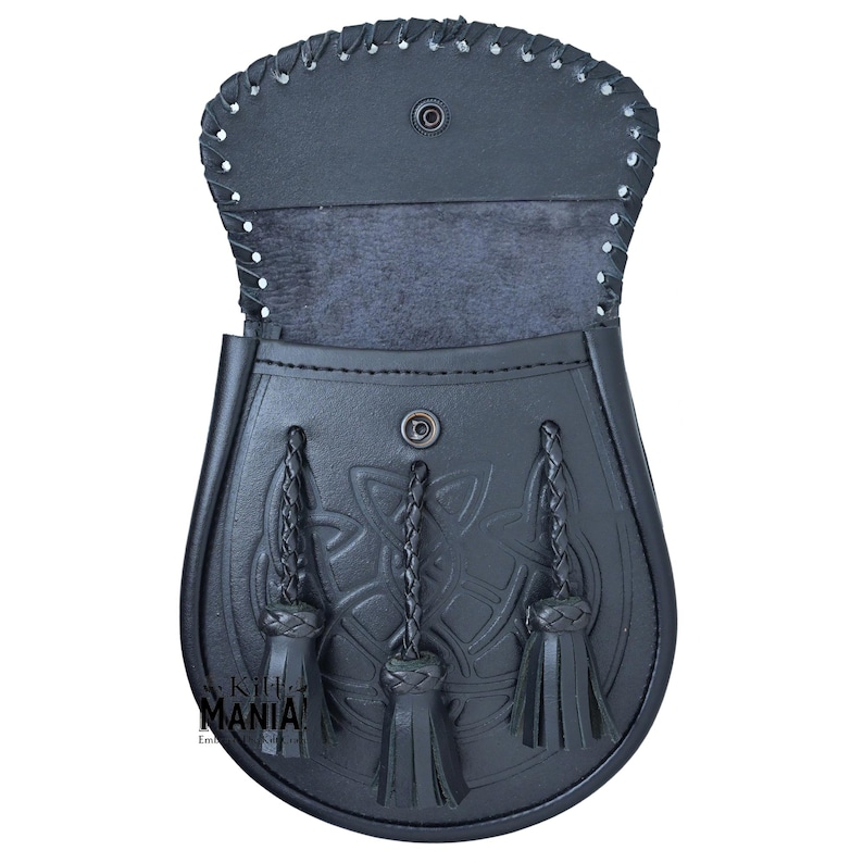 May include: Black leather kilt sporran with a Celtic knot design and three tassels. The sporran has a flap that opens to reveal a soft lining.
