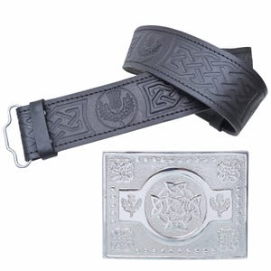 May include: Black leather belt with embossed Celtic knot and thistle designs. A silver-colored rectangular buckle with similar embossed patterns is also shown. The belt has a metal buckle closure.