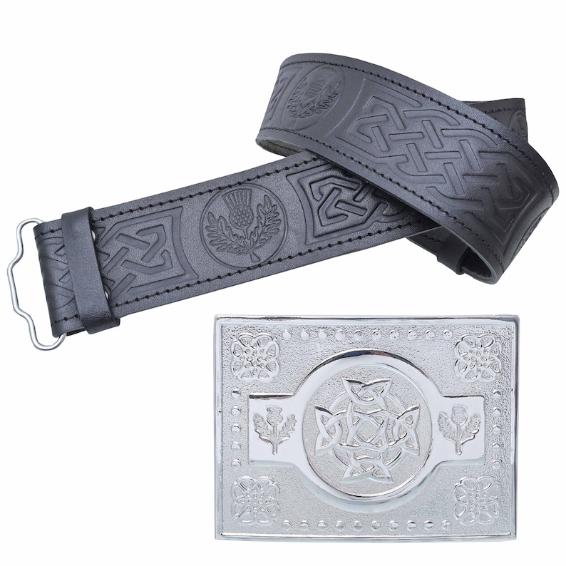 May include: Black leather belt with embossed Celtic knot and thistle designs. A silver-colored rectangular buckle with similar embossed patterns is also shown. The belt has a metal buckle closure.