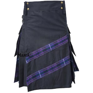 May include: A navy blue kilt with purple and green plaid accents. The kilt features a pleated design with decorative buckles and gold-colored hardware. The text "Kilt MANIA!" is visible on the side.