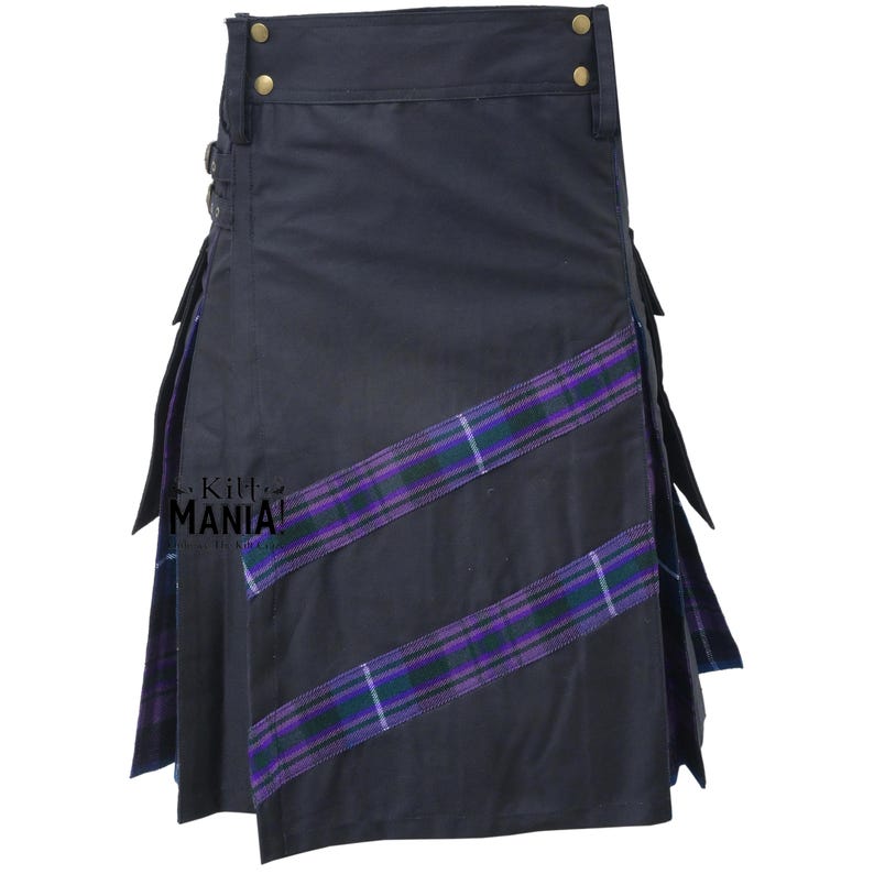 May include: A navy blue kilt with purple and green plaid accents. The kilt features a pleated design with decorative buckles and gold-colored hardware. The text "Kilt MANIA!" is visible on the side.