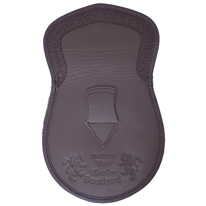 May include: Brown leather kilt sporran with a decorative stitched design and the text "Made of Real Leather Scotland".