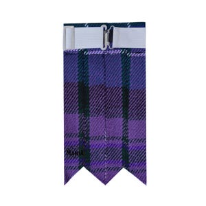 May include: Purple and green tartan kilt hose with a white elastic strap and buckle. The hose has a pointed bottom with three points.