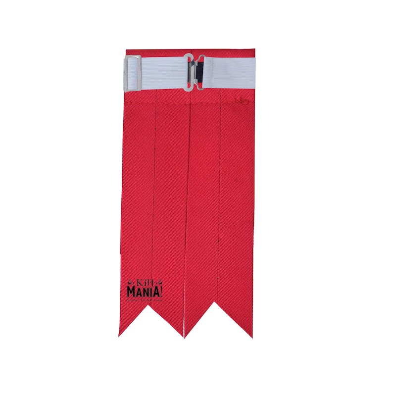 May include: Red kilt hose with a white elastic band and a black buckle. The hose has a pointed end and the text "Kilt Mania!" is printed on the bottom.