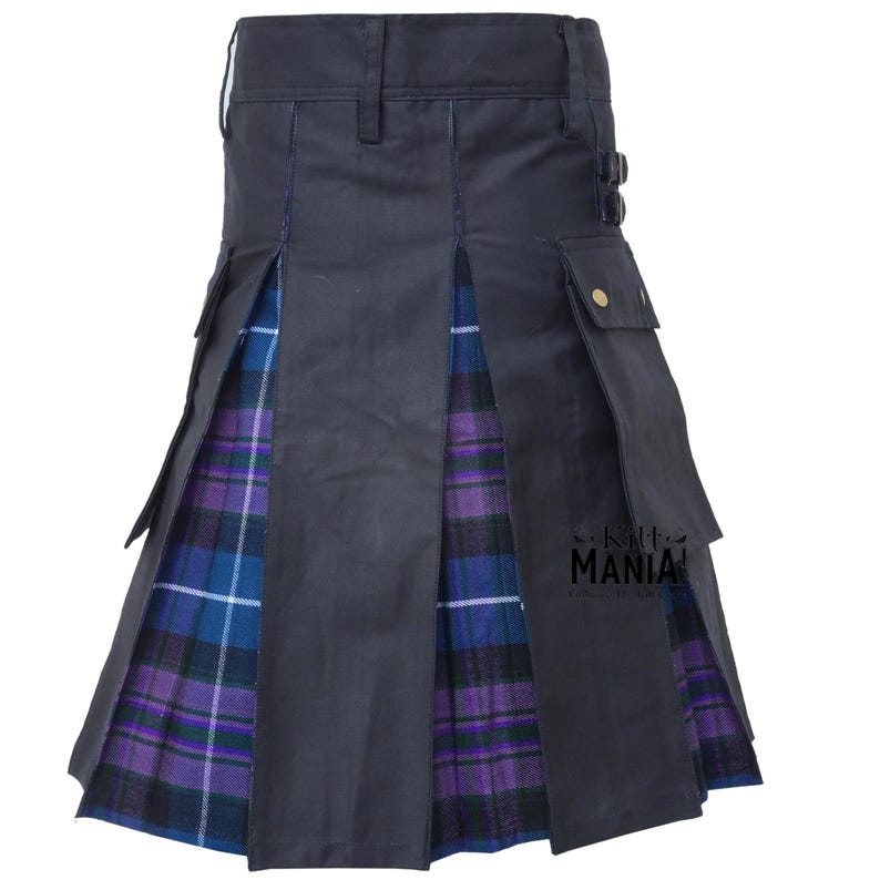 May include: A dark navy kilt with a purple and blue plaid pattern. The kilt features pleats, pockets, and a buckle closure. The kilt has the text "kilt MANIA" on the bottom right.